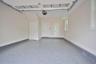 Garage with baseboards and a garage door opener