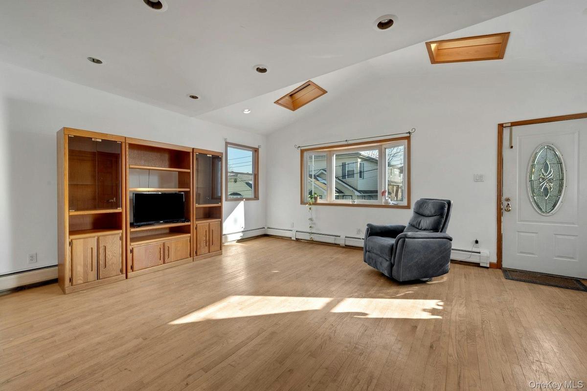 Entrance Nice size living room with 2 skylights
