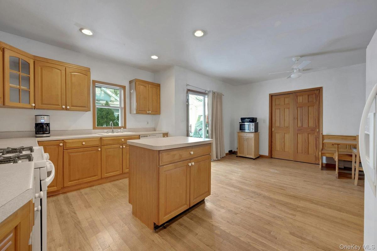 Eat in Kitchen with island, has storage  cabinets plus kitchen has a lot of cabinets