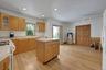 Eat in Kitchen with island, has storage  cabinets plus kitchen has a lot of cabinets