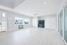 Unfurnished living room featuring ceiling fan, recessed lighting, and light wood-style flooring