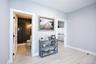 Corridor with light wood finished floors and baseboards