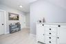 Hallway with baseboards and light wood finished floors