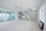 Entrance foyer featuring ceiling fan, light wood finished floors, stairs, and recessed lighting