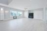 Unfurnished living room featuring a ceiling fan, recessed lighting, and light wood finished floors