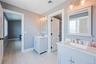 Full bathroom featuring wood finished floors and two vanities