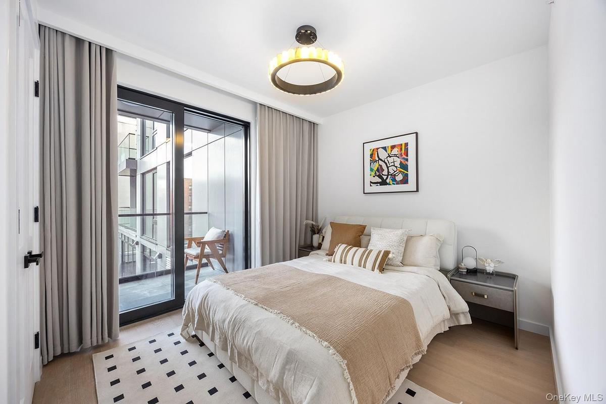 Bedroom featuring wood finished floors and access to outside