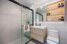Full bath featuring vanity, a shower stall, and tile patterned flooring