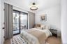 Bedroom featuring wood finished floors and access to outside