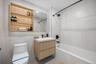 Full bathroom with vanity,  shower combination, and light tile patterned floors