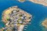 Aerial overview of property's location with property boundaries highlighted and a nearby body of water