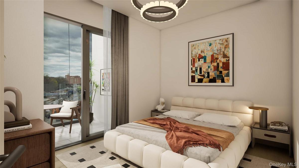 Bedroom with access to outside and a chandelier