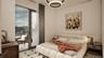 Bedroom with access to outside and a chandelier