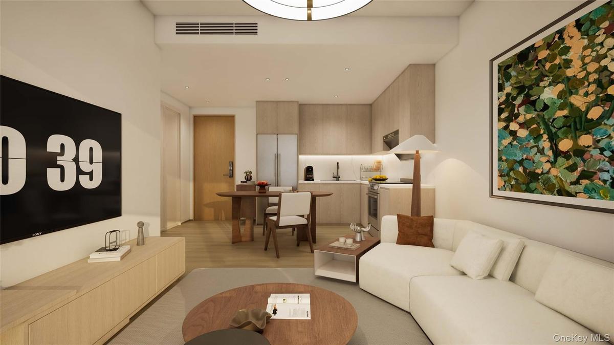 Living room featuring light wood-style floors and recessed lighting
