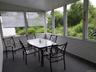 Sunroom with vaulted ceiling and carpet