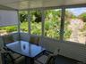 Sunroom featuring outdoor dining area
