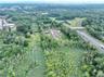 Aerial view of property's location featuring a forest