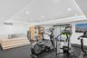 Exercise room featuring recessed lighting, plenty of natural light, and baseboards