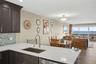 Kitchen with quartz counters, work station sink.