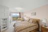 Primary Bedroom with sliding glass doors to the deck and Long Island Sound Views.