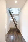 Rolling stairs leading up to attic space
