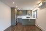 Kitchen featuring a peninsula countertop, stainless steel appliances, a wall mounted AC