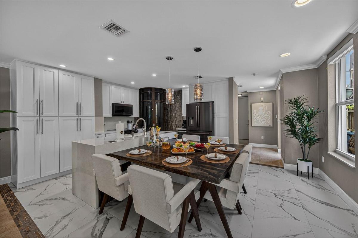 Open layout kitchen with dining for 6 & separate dining for 4-6. Total 12