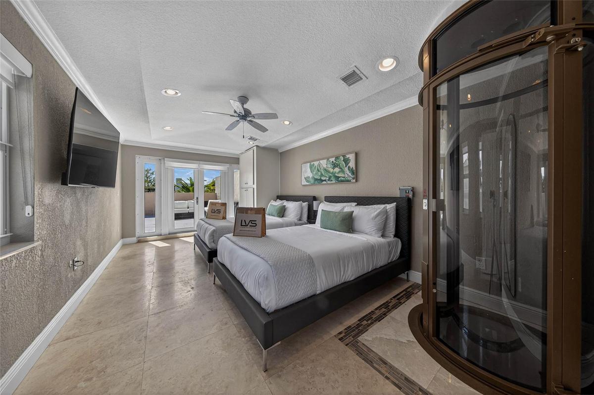 Bedroom #3- 3rd Floor Bedroom with 2 Double Beds & Exit to Rooftop Deck