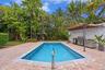 Back patio, pool, and outdoor kitchen.