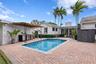 Back patio, pool, and outdoor kitchen.