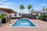 Backyard with pool & outdoor kitchen.