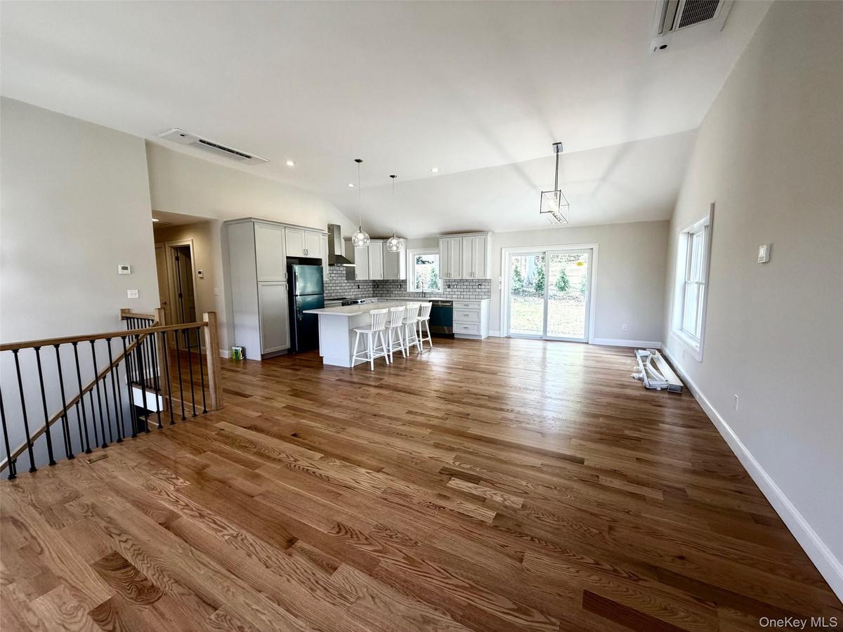 Dining Room to the left of Kitchen with Overhead Light Fixture