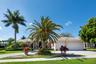 Front view with 3 car garage