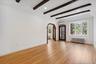 Large Bay Window and Wood Beamed High Ceiling