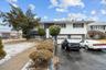 View of front of property with a garage and aphalt driveway