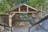 Fenced backyard featuring a patio and a gazebo