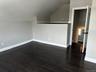Bonus room with wood finished floors and lofted ceiling