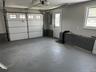 Garage with a garage door opener and electric panel