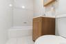Full bathroom featuring vanity and light tile patterned floors
