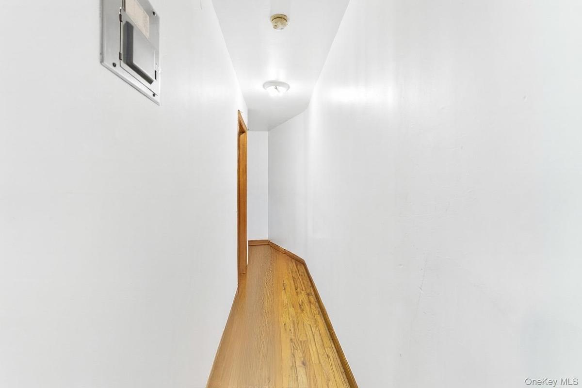 Corridor featuring light wood-type flooring