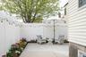 Fenced backyard with a patio