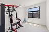 Workout area with baseboards and light tile patterned floors