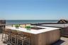 Wooden terrace with a water view and a sink