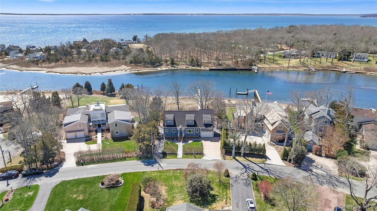 Built brand new in 2022 - A rare waterfront offering where your private deep water dock meets wide open creek with direct access to the Peconic Bay.