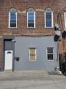 View of property exterior with brick siding