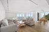 OPEN CONCEPT LIVING-DINING SPACE ALL WITH DIRECT OCEANFRONT VIEWS