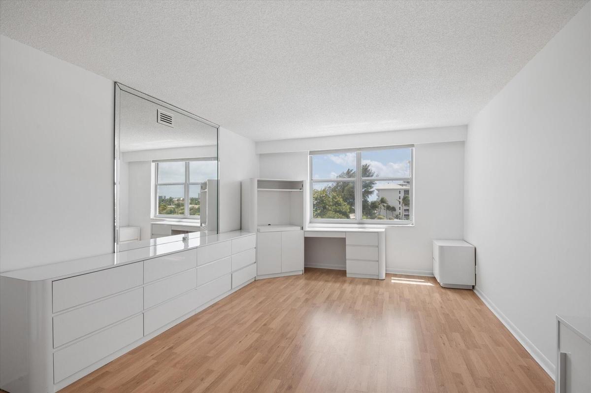 PRIMARY BEDROOM WITH BUILT-IN STORAGE, PARTIALLY FURNISHED -NO BED.