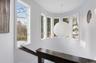 Curved wall with a multi-pane window configuration and a distinctive circular wall accent