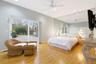 Recessed lighting, ceiling fan, wood-finish flooring, full-wall mirror, and sliding glass doors to a paved patio