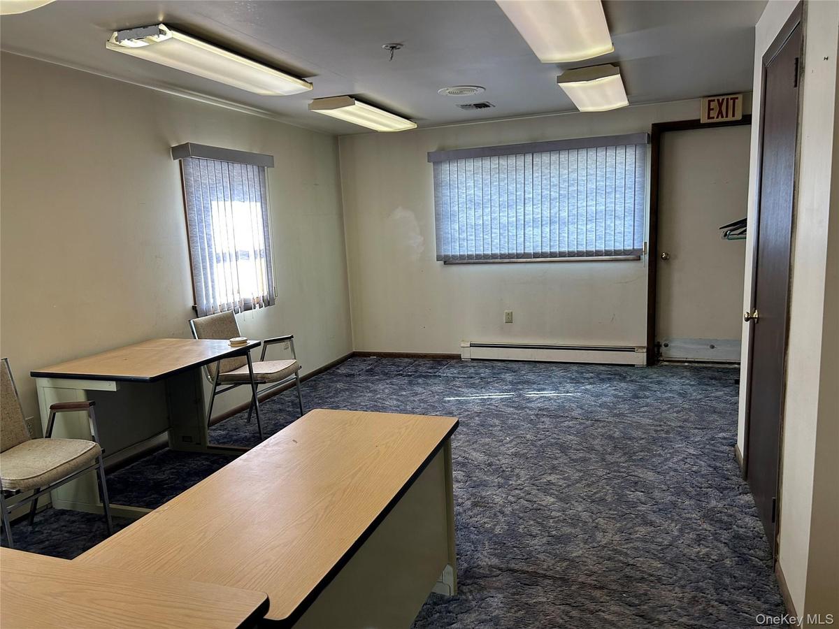 Unfurnished office featuring a baseboard radiator